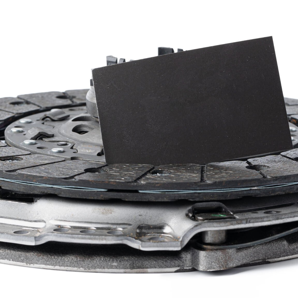 New automotive clutch on a white background. Close up.